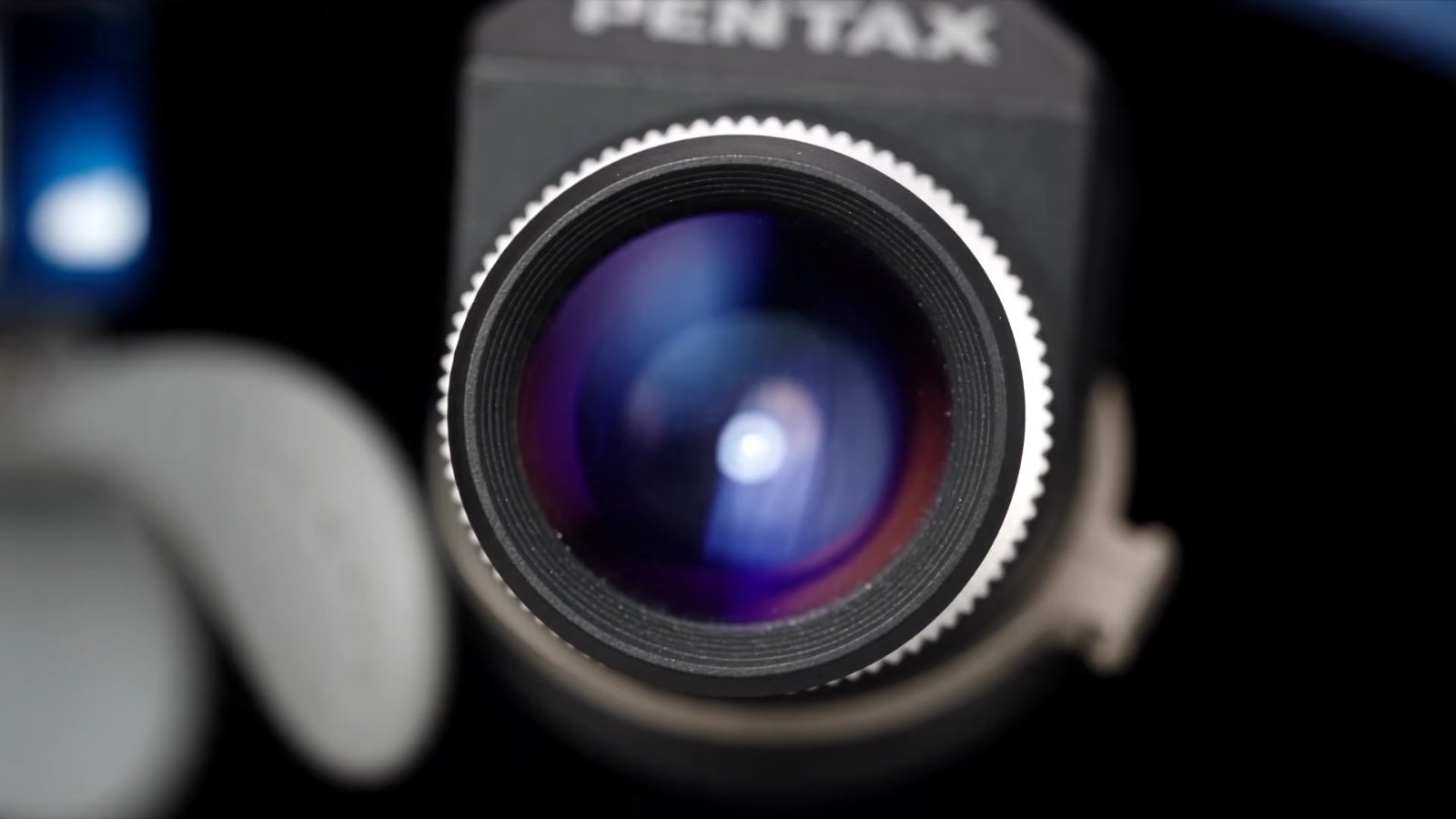 Close-up of a PENTAX Loupes lens barrel